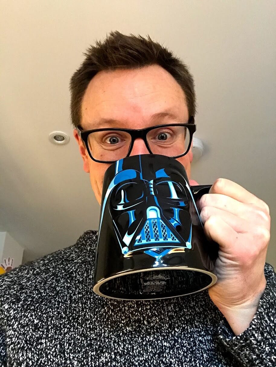 Matt Moore Freelance Web Developer drinking coffee from Darth Vader mug